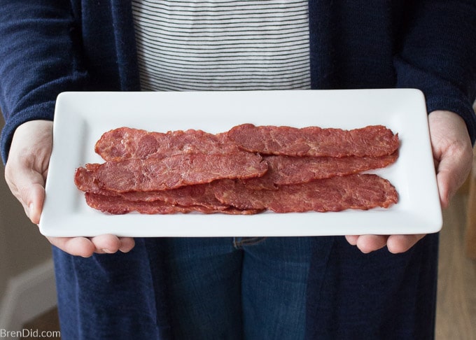 turkey bacon on platter in women's hands