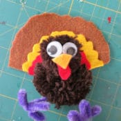 Thanksgiving kid crafts - making yarn pom pom turkeys and Free Birds on Netflix
