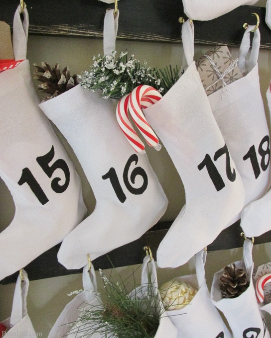 Pinning to make for Christmas! Easy and Affordable Christmas Decorations: PB inspired Wooden Advent Calendar with Stockings – Make a Pottery Barn Inspired Wooden Advent Calendar Ladder with Canvas Stockings f for $34. That’s 83% off of the retail price of $199. Free printable pattern, Silhouette cut file and easy directions at BrenDid.com.