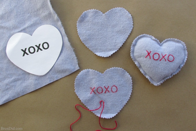 Easy Valentine's Day Craft: Conversation Heart Microwave Homemade Heating Pad - These easy to make heating pads are filled with whole grain rice or kosher salt. They can be heated by placing them in the microwaveor placed in the freezer to use as cool packs. They are all natural, reusable and much healthier than using a chemical filled self warming heat or cold pack.