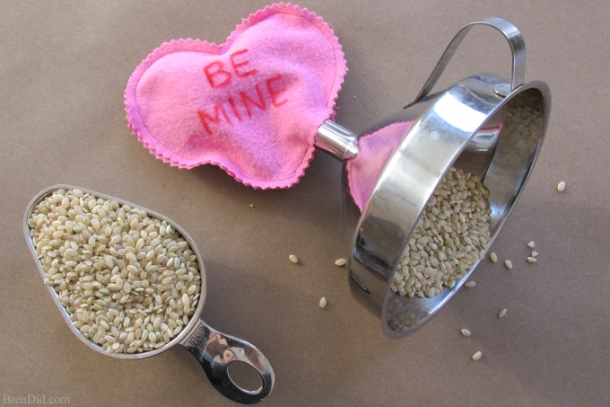 Easy Valentine's Day Craft: Conversation Heart Microwave Homemade Heating Pad - These easy to make heating pads are filled with whole grain rice or kosher salt. They can be heated by placing them in the microwaveor placed in the freezer to use as cool packs. They are all natural, reusable and much healthier than using a chemical filled self warming heat or cold pack.