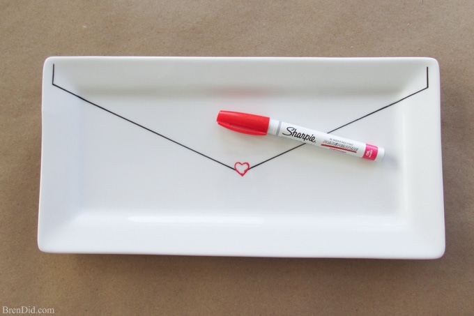 Introduce some West Elm style into your décor for a fraction of the price (55% off!) with this DIY craft project. In just a few minutes you’ll have a custom Catch All Tray that looks like a romantic love letter with this easy Sharpie Plate Tutorial.