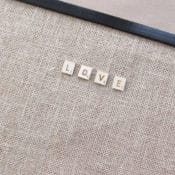 This sweet Scrabble burlap bulletin board spells LOVE (in Scrabble style letters) for your favorite room. Get some Pottery Barn inspired style at a fraction of the price (77% off) with this easy project from BrenDid.