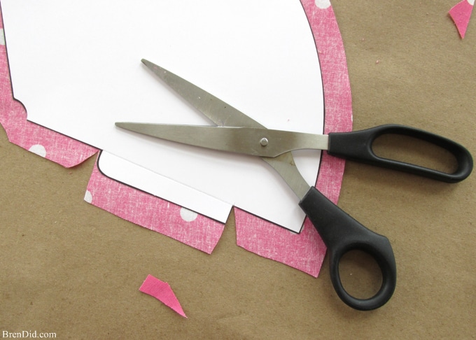 Fabric covered party hats are an easy craft and an affordable way to take your birthday party decor to the next level. With a little patterned fabric, glue, yarn and card stock you can turn a common party decoration into something extraordinary.