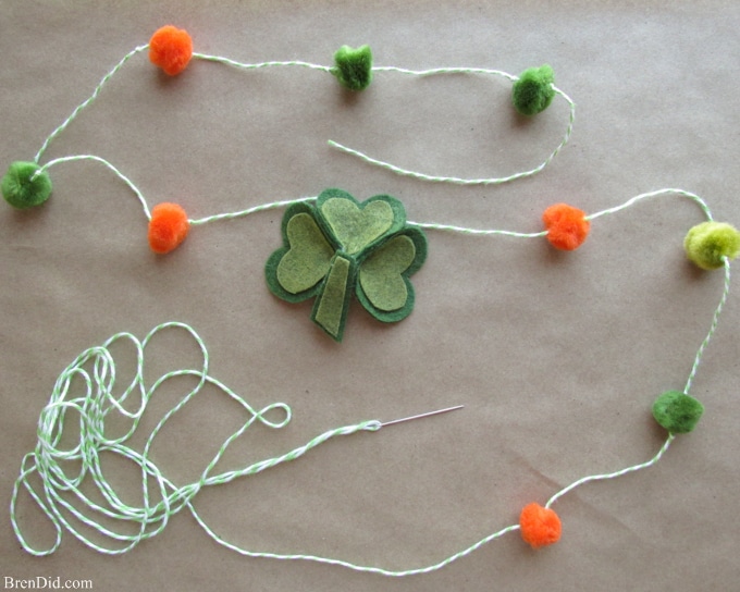 Are you a St. Patrick’s Day lover? Make a fun and easy St. Patrick’s Day Shamrock garland using felt, bakers twine and premade pom poms.