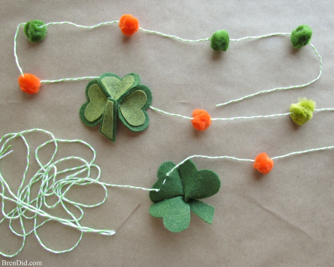 Are you a St. Patrick’s Day lover? Make a fun and easy St. Patrick’s Day Shamrock garland using felt, bakers twine and premade pom poms.