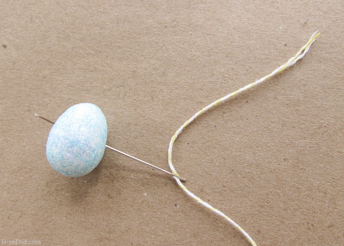 Pottery Barn Kids inspired glitter Happy Easter banner made from cardstock, twine, beads, and glitter styrofoam eggs. Takes only a few minutes to assemble and cost $4.00! Add a special touch to your Easter décor.