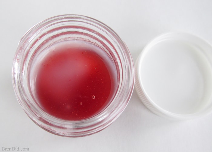 DIY Sweet Strawberry Lip Balm recipe uses simple, all-natural ingredients including real strawberries to make a lightly tinted and flavored lip gloss. Free printable label. Must try! 