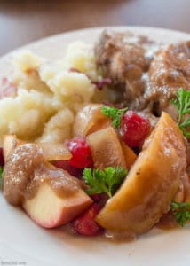 Easy slow cooker recipe. Boneless pork chops or pork ribs simmer with cranberries, onion and apples to create a delicious dish flavored with balsamic vinegar. Healthy crock pot recipe.