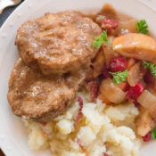 Easy slow cooker recipe. Boneless pork chops or pork ribs simmer with cranberries, onion and apples to create a delicious dish flavored with balsamic vinegar. Healthy crock pot recipe.