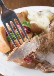 Easy slow cooker recipe. Boneless pork chops or pork ribs simmer with cranberries, onion and apples to create a delicious dish flavored with balsamic vinegar. Healthy crock pot recipe.