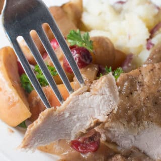 Easy slow cooker recipe. Boneless pork chops or pork ribs simmer with cranberries, onion and apples to create a delicious dish flavored with balsamic vinegar. Healthy crock pot recipe.
