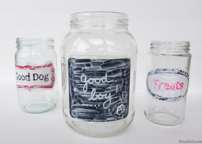 Easy Upcycled Pet Treat Container - Making craft projects from recycled materials is a great way to save on craft costs while reducing waste. These adorable upcycled pet treat jars reuse glass jars from your kitchen. 