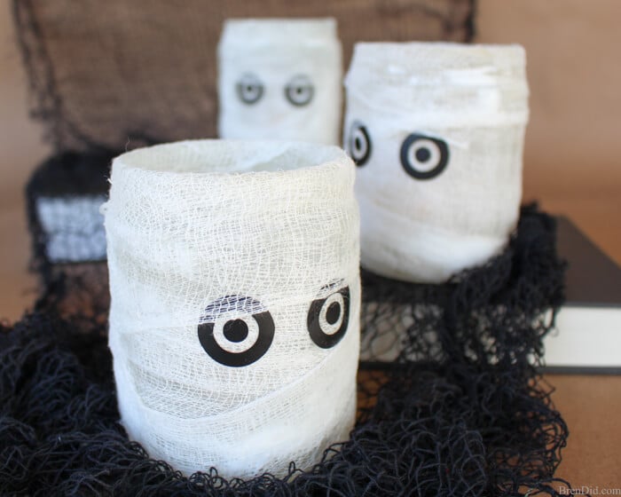 Easy Homemade Halloween Decoration -Learn how I make this easy Mummy Luminary that looks like a Pottery Barn candle holder but cost much less!