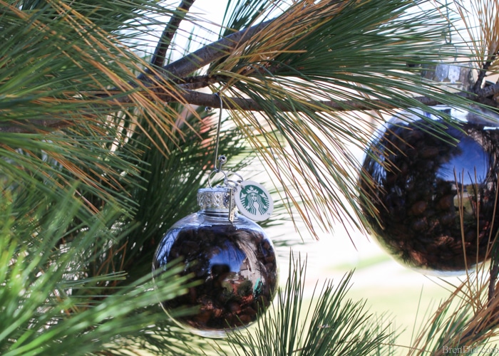 Create the perfect customizable ornament for all the coffee lovers on your gift list with this holiday craft idea, This tutorial for easy coffee bean ornaments is an easy and affordable way to make the season merrier!