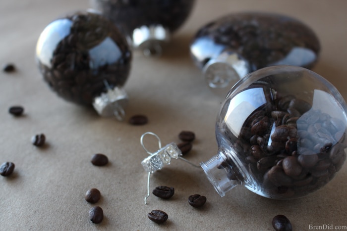 Create the perfect customizable ornament for all the coffee lovers on your gift list with this holiday craft idea, This tutorial for easy coffee bean ornaments is an easy and affordable way to make the season merrier!