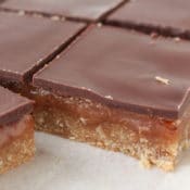 This delicious caramel slice recipe has a layer of shortbread topped w/ luscious caramel & rich chocolate. Millionaire Shortbread, No corn syrup. No sweetened condensed milk. Boxing Day favorite!