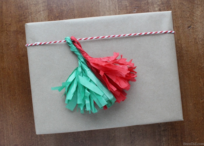 How to Make Tassels from Tissue Paper - Make your own free eco-friendly paper tassels for garlands and gift tie-ons using just tissue paper and scissors. They are a huge DIY trend and they are free by reusing tissue paper!   