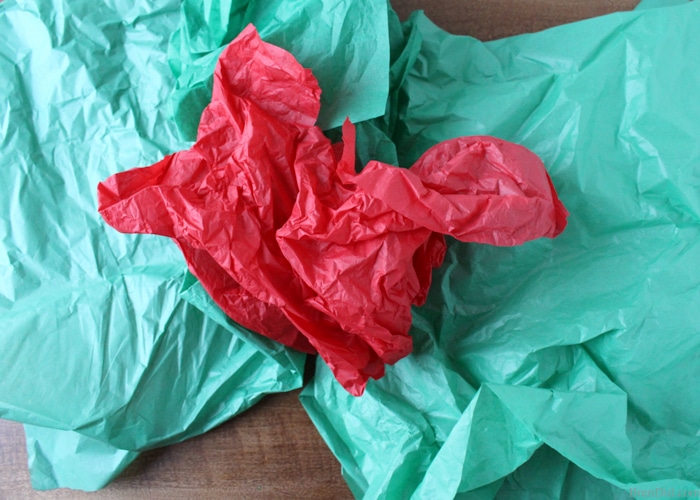 How to Make Tassels from Tissue Paper - Make your own free eco-friendly paper tassels for garlands and gift tie-ons using just tissue paper and scissors. They are a huge DIY trend and they are free by reusing tissue paper!   