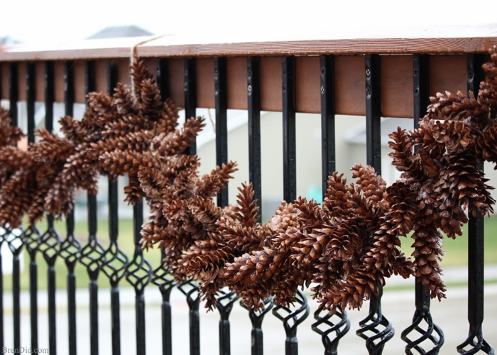 Learn how to make an pine cone garland for a touch of woodland style. This easy tutorial shows you how to create your own easy pine cone garland for less than $1.30 per foot. Eco-friendly.