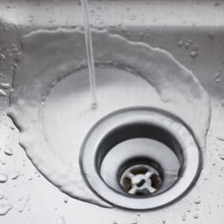 Want to naturally unclog a sink or clean a slow moving drain? Learn why you should not use baking soda and vinegar to clean your drains and what green solutions really work!