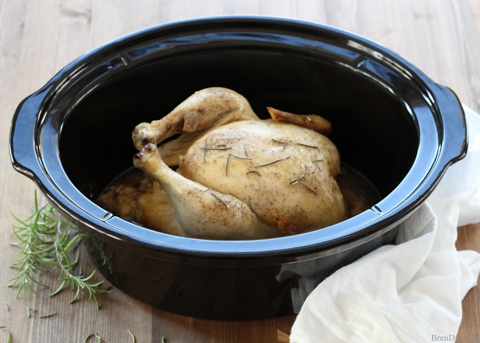 Crazy Easy Roast Chicken in the Slow Cooker - This quick and easy whole chicken recipe will become a staple in your house. It is a healthy alternative to store-bought rotisserie chicken with a wonderful flavor, crispy skin and tender meat. 