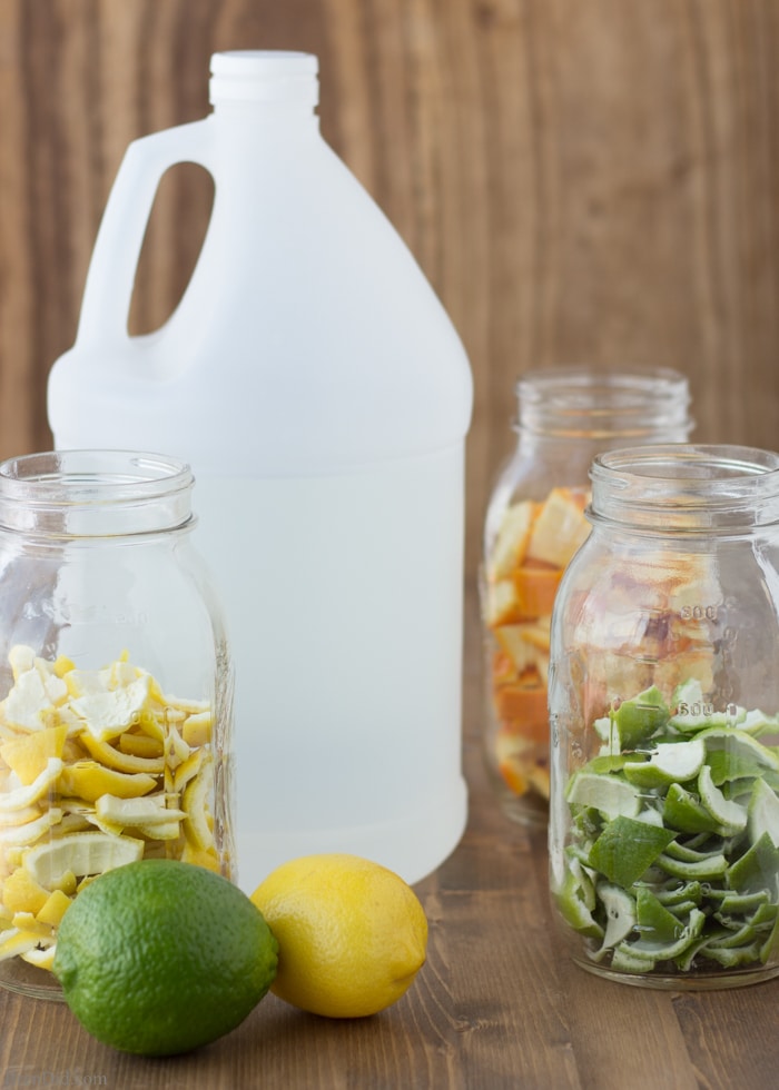 Vinegar for Cleaning with citrus peels in jars