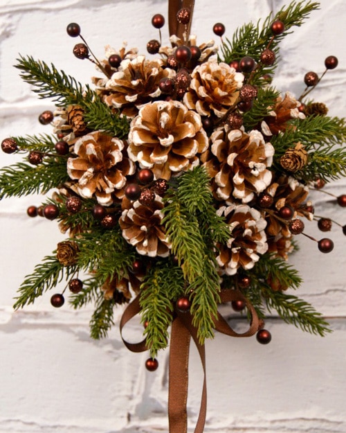 Decorating with pine cones for the holidays is free and beautiful. These 30 easy crafts add pine cones to your home decor this winter.