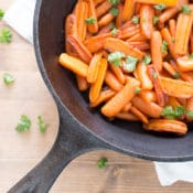 Roasted carrots are cooked in a light sauce of butter, honey, ginger, and lemon. The oven brings out the naturally sweet flavor of the roasted carrots and turns the sauce into a tasty glaze.