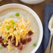 Ultimate light potato soup for the crock pot is an easy, healthy and delicious dinner choice that is sure to please your family. It’s easy on your budget and knocks 370 calories per serving off the original. Try this healthy crock pot recipe today!