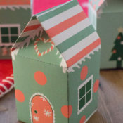 Elf house treat boxes for Christmas. These free printable treat boxes capture the magic of elf villages. They make perfect Secret Santa presents, stocking stuffers, and cookie holders.