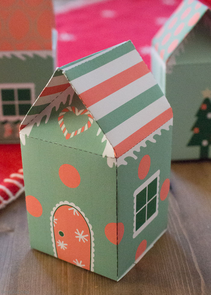 Elf house treat boxes for Christmas. These free printable treat boxes capture the magic of elf villages. They make perfect Secret Santa presents, stocking stuffers, and cookie holders. 