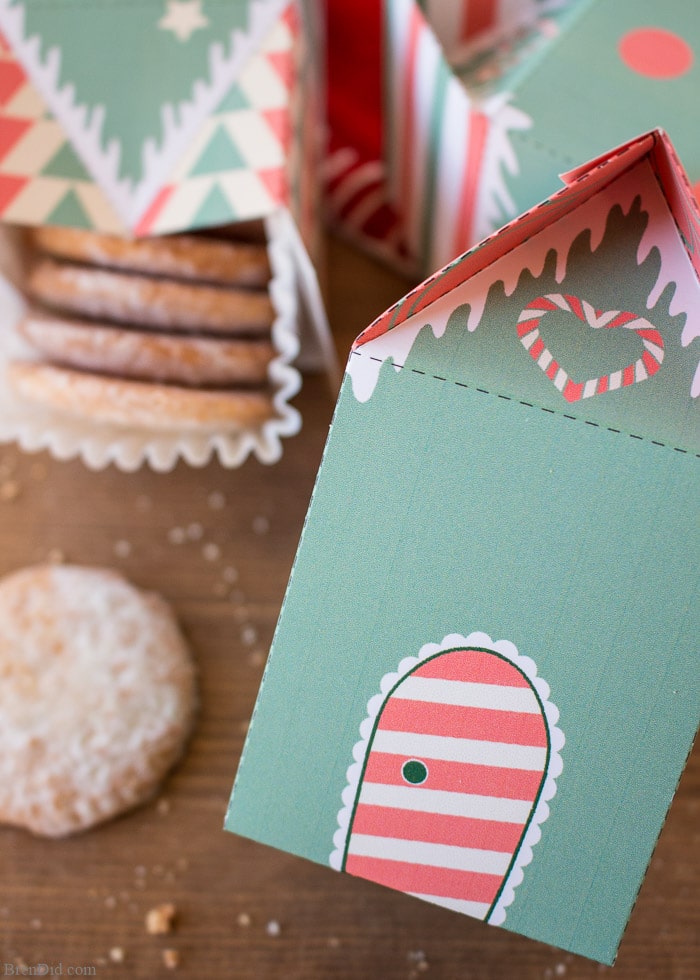 Elf house treat boxes for Christmas. These free printable treat boxes capture the magic of elf villages. They make perfect Secret Santa presents, stocking stuffers, and cookie holders. 