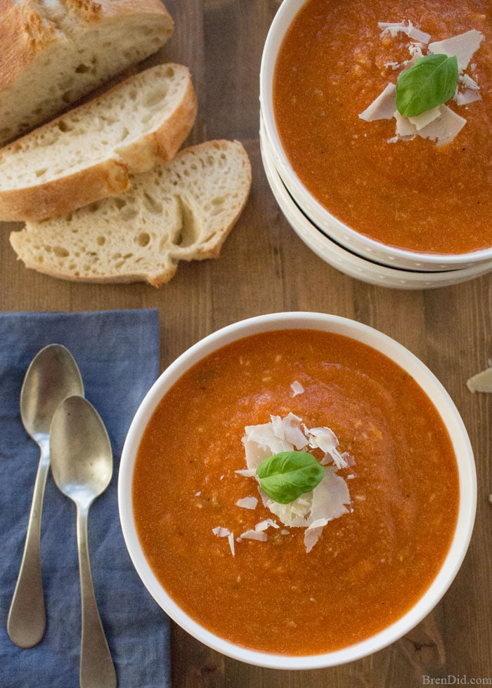Creamy, comforting, and cheesy this healthy slow cooker tomato basil parmesan soup is packed with vegetables that give it incredible flavor without all the fat and calories. Shhh… no one will know it’s anything but delicious creamy tomato soup!