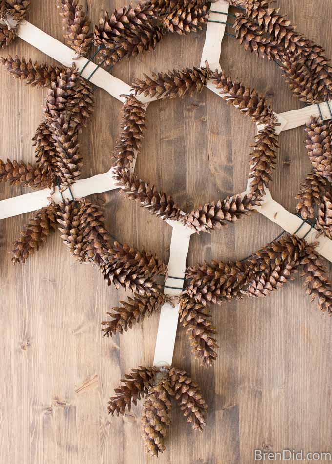 Glue pinecone to tip of each point