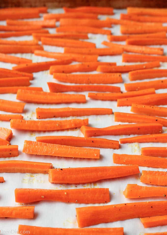 Carrot fry strips on a baking sheet