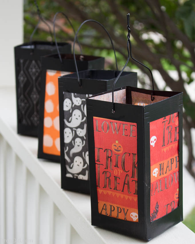 simple milk cartons paper lanterns on porch railing