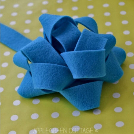 traditional felt bow on wrapping paper