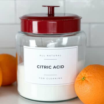 Citric acid for cleaning in a glass storage jar.