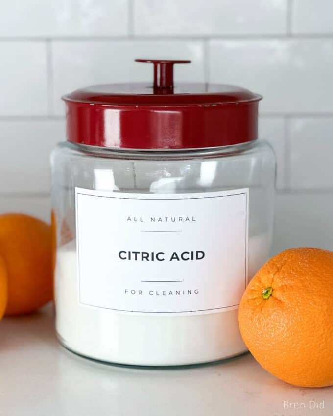 Citric acid for cleaning in a glass storage jar.